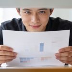 Designer analyzing workflow on modern workstation hardware.